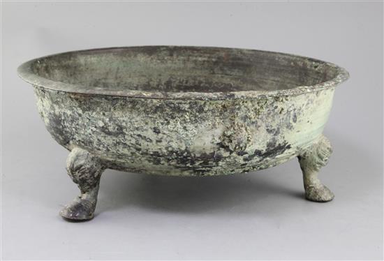 A Chinese archaic bronze tripod water basin, Pan, Warring States period, 4th/2nd century B.C., 39cm diameter, holes beneath rim